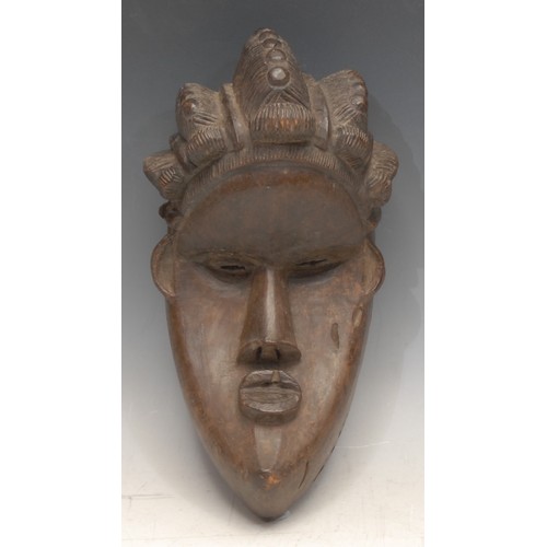 3759 - Tribal Art - a Bassa [Basa] mask, concave features, elaborate coiffure, 27cm long, Liberia, West Afr... 