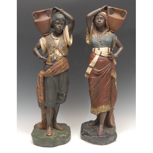 3649 - A pair of painted moulded plaster Blackamoor figures, water carriers, 51cm, unmarked