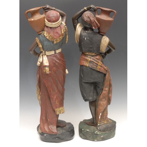 3649 - A pair of painted moulded plaster Blackamoor figures, water carriers, 51cm, unmarked