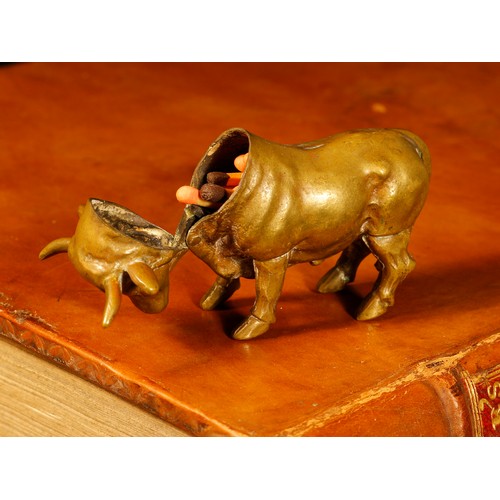 3533 - A 19th century brass novelty vesta case, as a bull, hinged cover, striker to leg, 7cm long