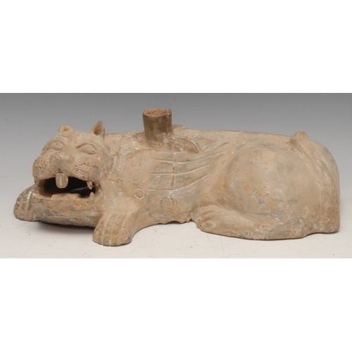 3674 - A Chinese terracotta burial model, temple lion curled resting, teeth bared, 34cm wide