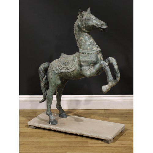 3640 - A verdigris patinated garden bronze, cast as a Chinese Tang Horse, stone base, 92cm high