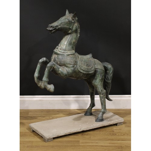 3640 - A verdigris patinated garden bronze, cast as a Chinese Tang Horse, stone base, 92cm high