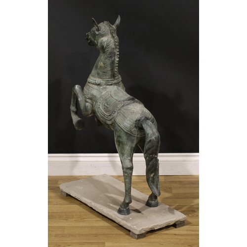 3640 - A verdigris patinated garden bronze, cast as a Chinese Tang Horse, stone base, 92cm high