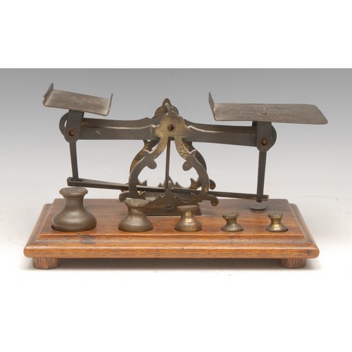 3200 - A set of Victorian oak and brass letter balance scales, the large plateau inscribed Postage Rates, L... 