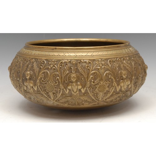 3587 - A 19th century Indian/Burmese gilt bronze bowl, cast and chased with deities, lotus and scrolling le... 