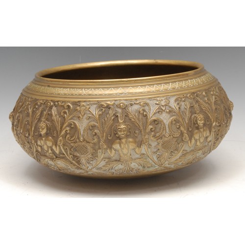 3587 - A 19th century Indian/Burmese gilt bronze bowl, cast and chased with deities, lotus and scrolling le... 