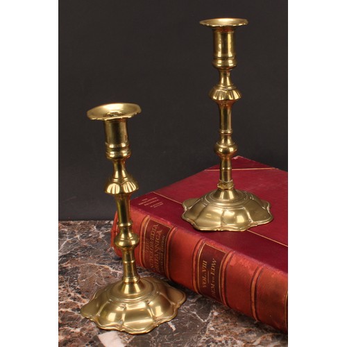 3618 - A pair of George II brass candlesticks, knopped pillars, domed shaped bases, 24cm high, c.1745