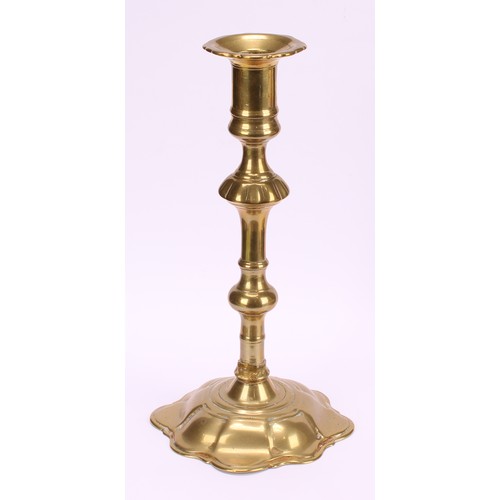 3618 - A pair of George II brass candlesticks, knopped pillars, domed shaped bases, 24cm high, c.1745