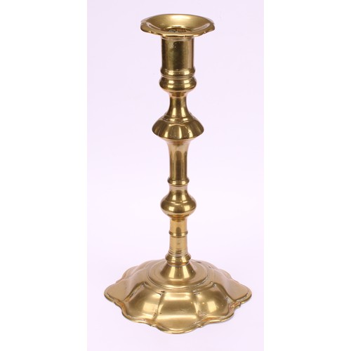 3618 - A pair of George II brass candlesticks, knopped pillars, domed shaped bases, 24cm high, c.1745