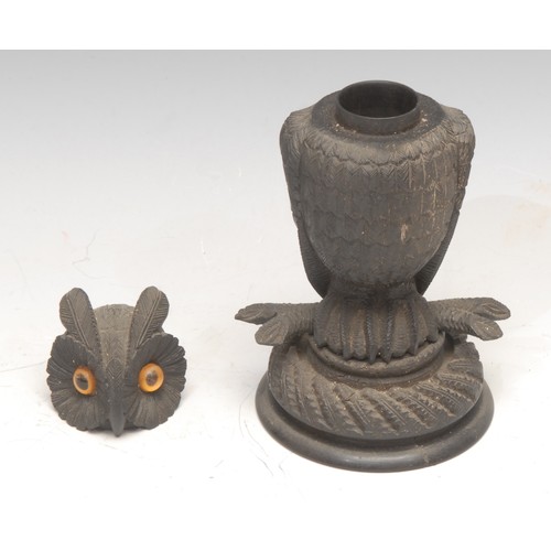 3508 - Treen - an Irish bog oak novelty box or inkwell, carved as an owl, glass eyes, 15.5cm high, early 20... 