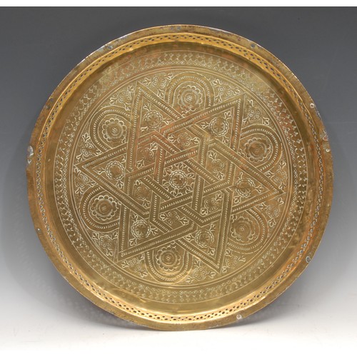 3125 - A North African circular brass charger or table top, decorated with Arabic script, animals and Egypt... 