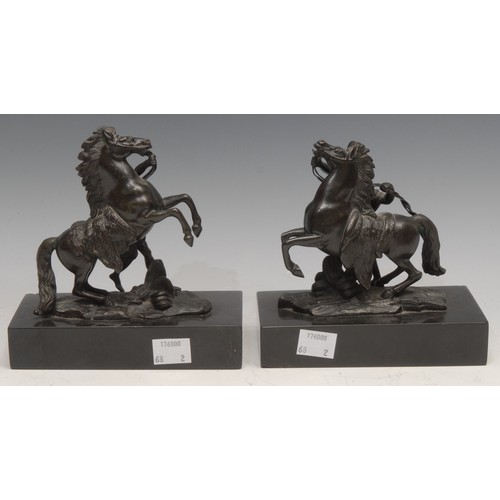 3239 - After Guillaume Coustou (19th century), a pair of dark patinated bronzes, The Marli Horse Tamers, re... 