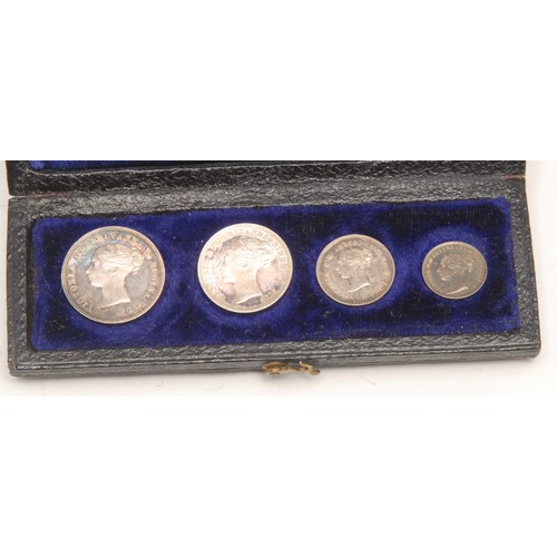 3972 - A Victorian Silver Maundy Coin money set, 1873, 4d. 3d. 2d. and penny, all near FDC,  in black leath... 