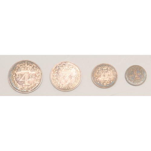 3972 - A Victorian Silver Maundy Coin money set, 1873, 4d. 3d. 2d. and penny, all near FDC,  in black leath... 