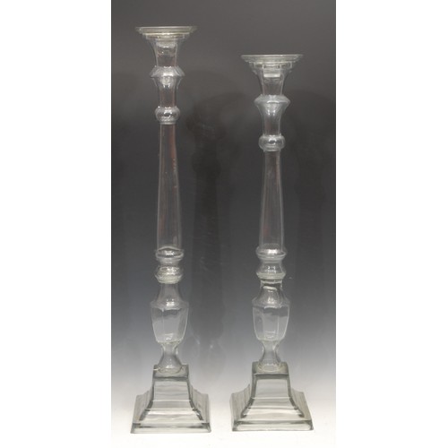 3432 - Interior Decoration - an unusually large pressed glass candlestick, spreading square base, 73cm high... 