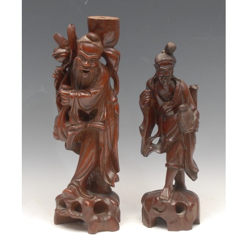 3672 - A Chinese carved hardwood figure, 34cm; another smaller, late 19th century (2)