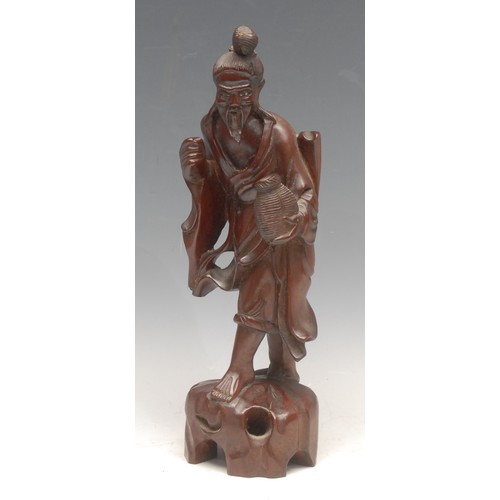 3672 - A Chinese carved hardwood figure, 34cm; another smaller, late 19th century (2)