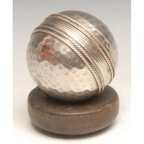 3481 - Sport - an unusual silver plated model of a cricket ball, 6.5cm diam, hardwood stand