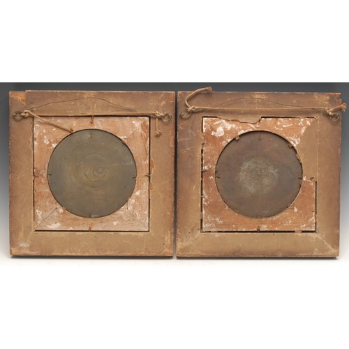 3143 - A pair of 19th century Neo-Classical dark patinated bronze roundels, cast in bas relief with Cupid a... 