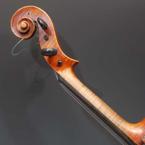 3730 - A violin, the two-piece back 35.5cm long excluding button, paper label printed Giovan Paolo Maggini,... 