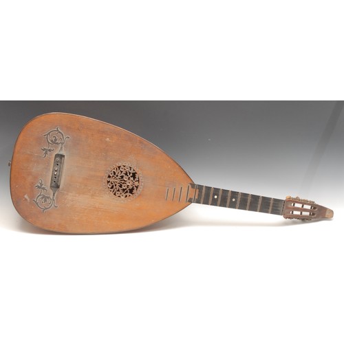 3725 - A lute, 51cm body applied with leafy scrolls, the sound hole pierced and carved with flowers and fol... 