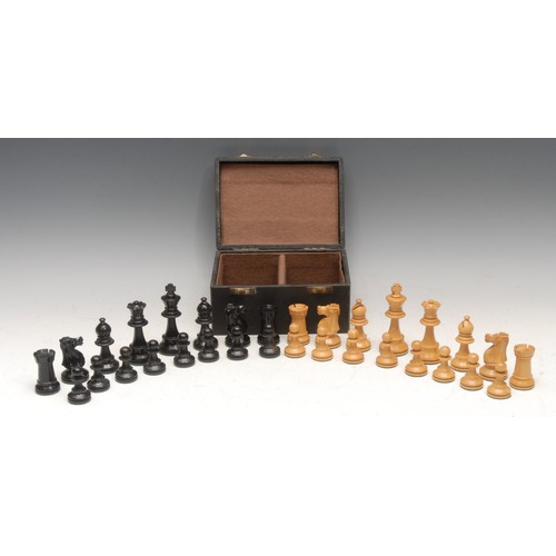 3017 - A boxwood and ebonised Staunton pattern chess set, weighted bases, the Kings 8.5cm high, boxed