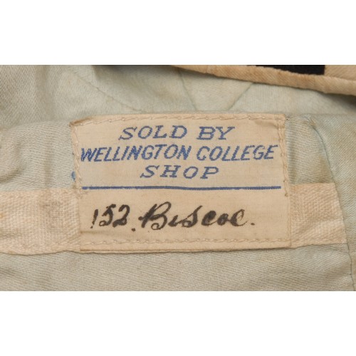 3480 - Sport - an early 20th century Rugby cap, labelled Sold by Wellington College Shop, 18cm diam