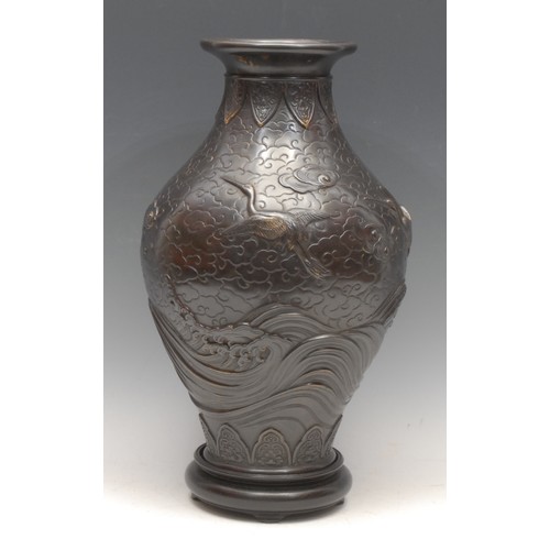 3407 - Genryusai Seiya (1868-1912), a Japanese dark patinated bronze ovoid vase, cast in relief with cranes... 