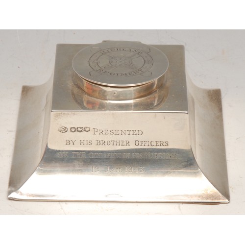 3075 - A George VI silver spreading square inkwell, of Scottish military interest, hinged cover enegaved wi... 