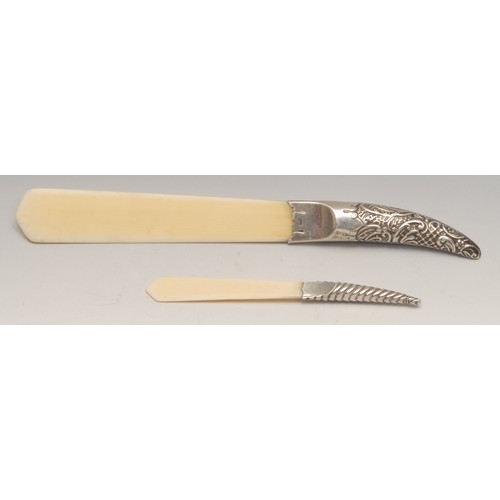 3221 - A Victorian silver hafted page turner, ivorine blade, 25cm long, Birmingham 1897; another, similar, ... 