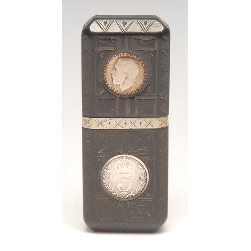 3315 - An early 20th century vulcanite type cigarette lighter, set with 3d coins, 7.5cm long