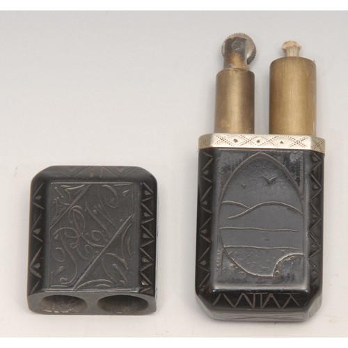 3315 - An early 20th century vulcanite type cigarette lighter, set with 3d coins, 7.5cm long