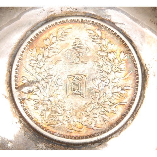 3203 - A silver coloured metal dish, set with a Chinese coin, 9cm diam, 57.3g gross