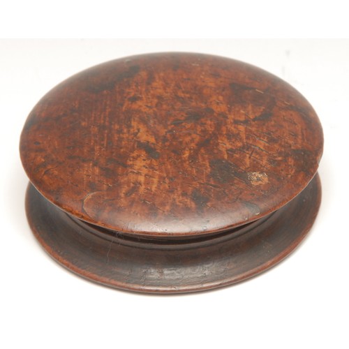 3499 - Treen - a 19th century turned oak circular box, the push-fitting cover now enclosing a plaster intag... 