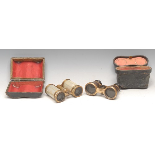3145 - A pair of 19th century Palais Royal type mother of earl opera glasses, 10.5cm wide, c.1890, cased; a... 
