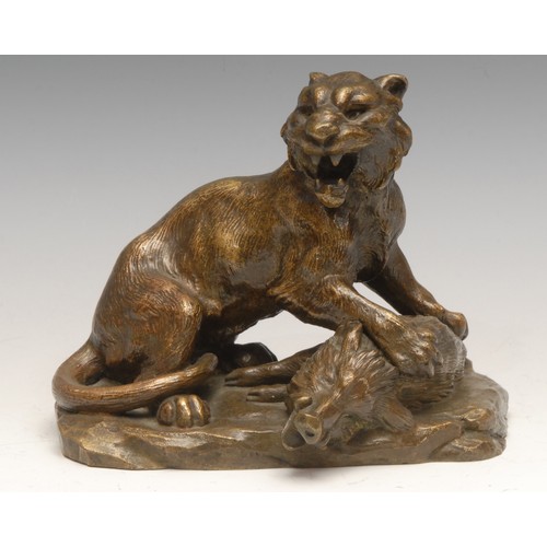 3632 - A 19th century French bronze, of a ferocious lion attacking a boar, 13cm high, c.1880