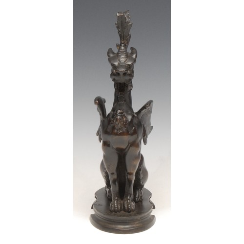 3633 - A 19th century patinated bronze, of a winged mythical beast, oval base, 23cm high, c.1880