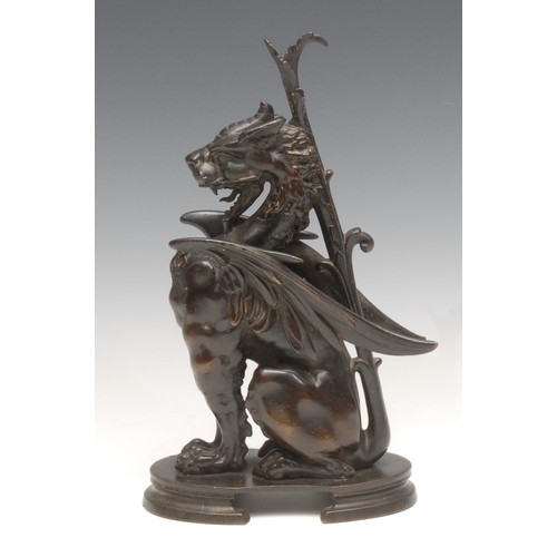 3633 - A 19th century patinated bronze, of a winged mythical beast, oval base, 23cm high, c.1880