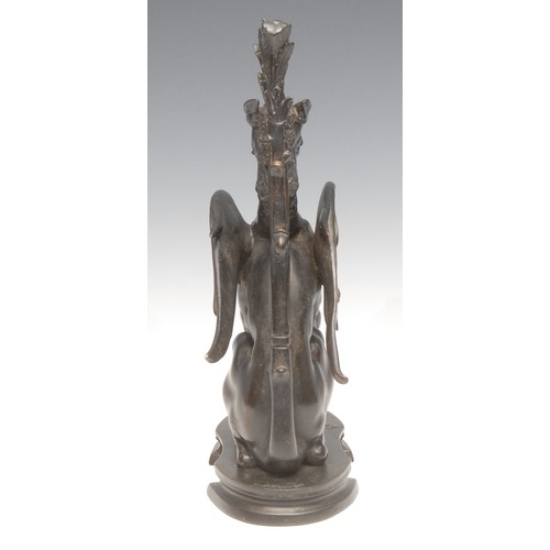 3633 - A 19th century patinated bronze, of a winged mythical beast, oval base, 23cm high, c.1880