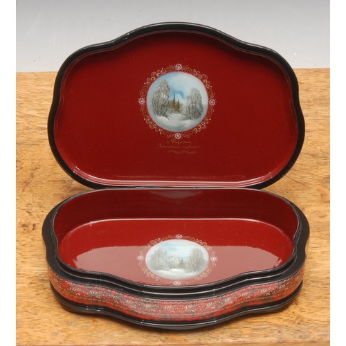 3179 - A reproduction Russian black lacquer box, of serpentine form, the hinged cover painted with a frozen... 