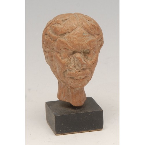 3795 - Antiquities - a terracotta fragment, head of a lady, 4cm high, mounted for display