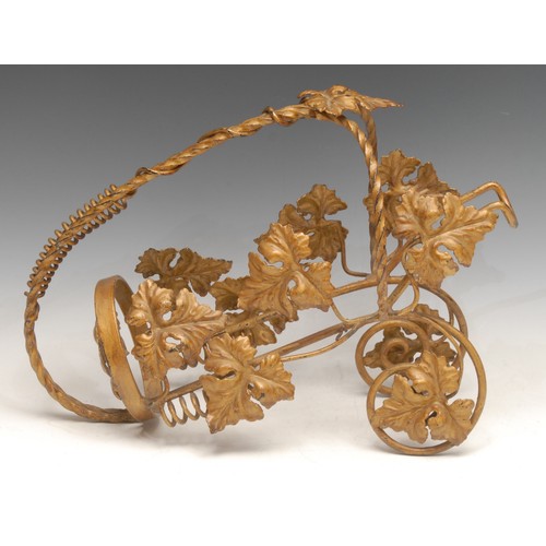 3067 - A French wrought iron wine cradle, worked throughout with scrolling vine, 34cm long