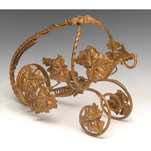 3067 - A French wrought iron wine cradle, worked throughout with scrolling vine, 34cm long