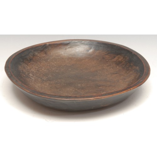 3506 - Treen - an adzed and dug-out dish or trencher, 23cm diam