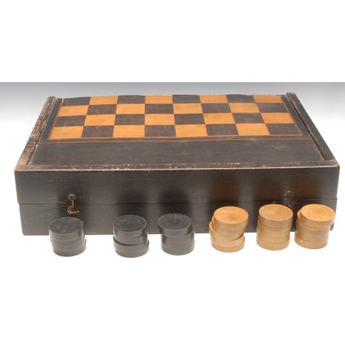 3091 - A large 19th century parquetry and ebonised retangular games box, inlaid with a chess board, the int... 