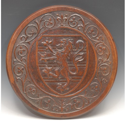 3415 - Heraldry - a 19th century mahogany armorial roundel, carved with the arms of Fairfax of Gilling Cast... 