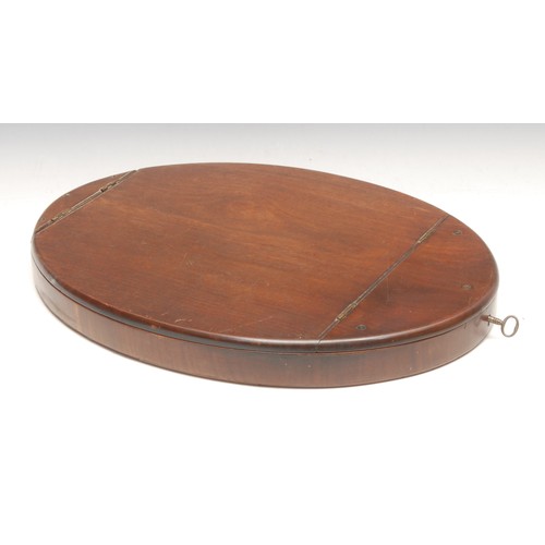 3594 - A 19th century mahogany oval campaign dressing mirror, hinged cover, the plate adjustable on a ratch... 