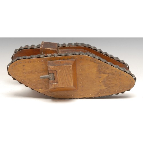 3395 - Folk Art - an early 20th century softwood novelty money box or bank, as a World War I tank, copper t... 