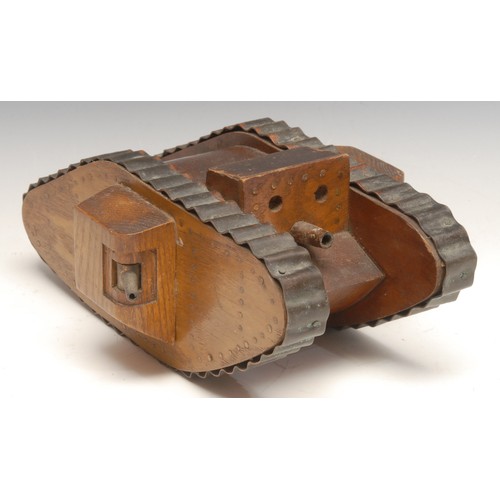 3395 - Folk Art - an early 20th century softwood novelty money box or bank, as a World War I tank, copper t... 